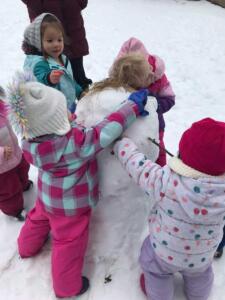 YCC students building a snowman